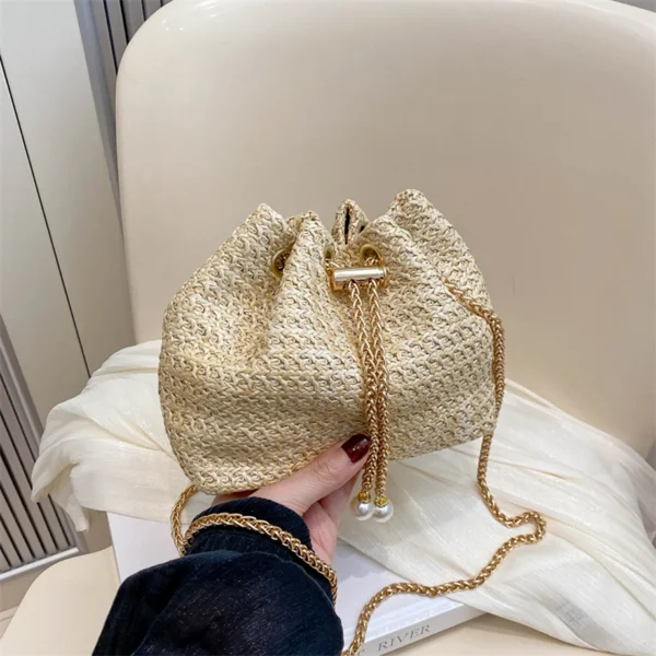 Ladies' mini straw woven bucket crossbody bag, hand woven pearl decoration drawstring straw woven small bag, gold chain shoulder bag, summer beach vacation special view 2