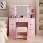 Pink particleboard with a 7-drawer, 4-shelf dressing table set with 10 three-tone light bulbs, power strip, and grille.